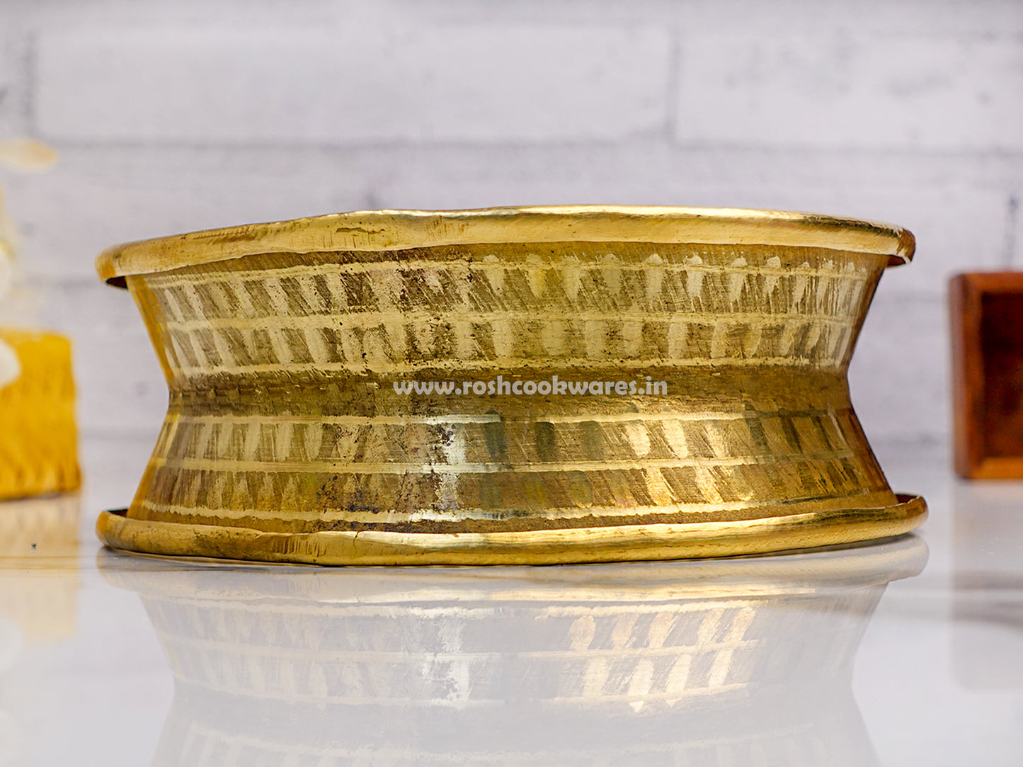 Brass Pirimanai round shape vessel stand for kitchen.